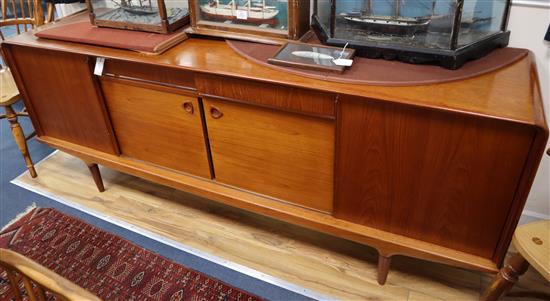 Clausen & Son, Silkeborg, Denmark, a teak sideboard fitted sliding doors, cupboard and drawers W.208cm